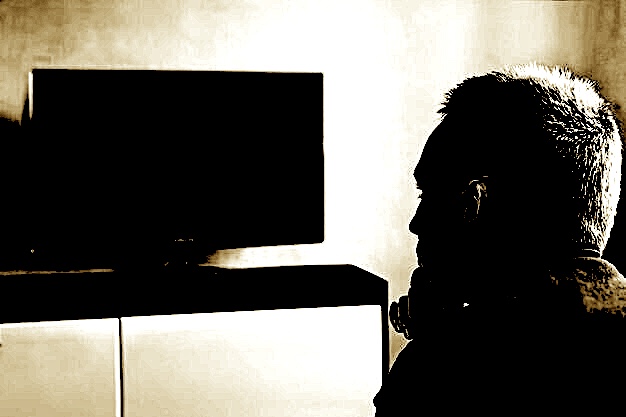 young-guy-watches-tv-turned-off-carefully-single-man-couch-watching-tv-changing-channels_431724-12472.jpg